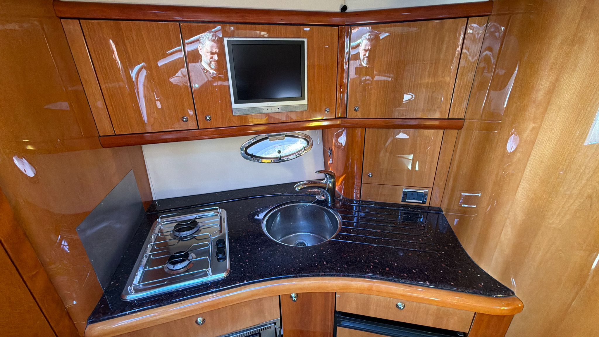 Galley with hob, sink and granite worktop